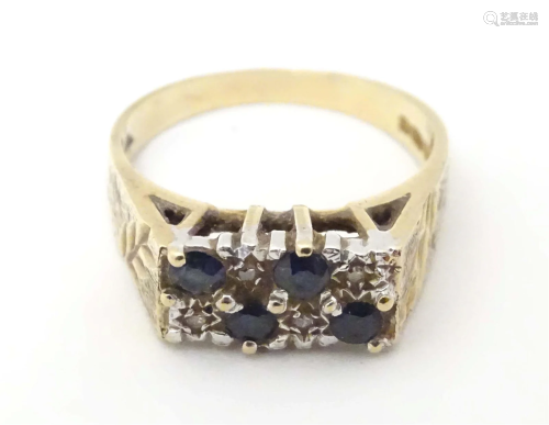 A 9ct gold retro dress ring set with sapphires and diamonds....