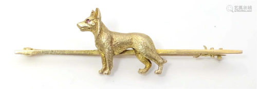 A 15ct gold bar brooch having with dog detail to centre. App...