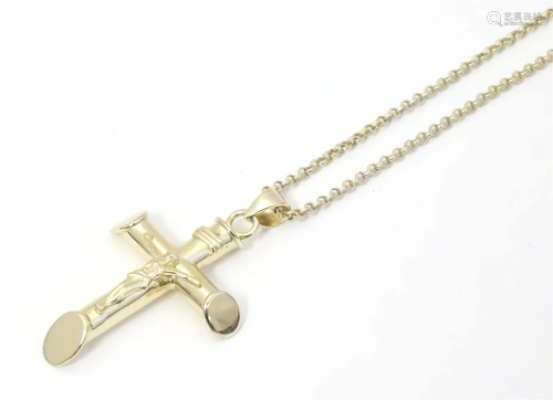 A silver gilt pendant of crucifix / cross form on a long cha...