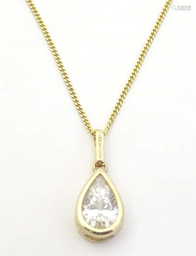 A 9ct gold pendant of teardrop form set with cubic zirconia,...