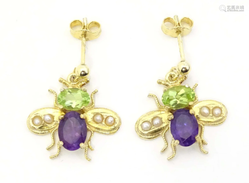 A 9ct gold drop earrings formed as butterflies / winged inse...