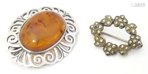 A .925 silver brooch set with amber cabochon. Together with ...