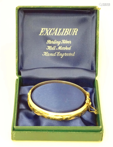 A silver bracelet of bangle form hallmarked Birmingham 1973 ...