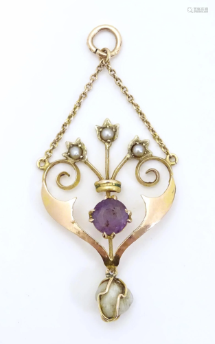An Art Nouveau 9ct gold pendant set with amethyst and pearls...