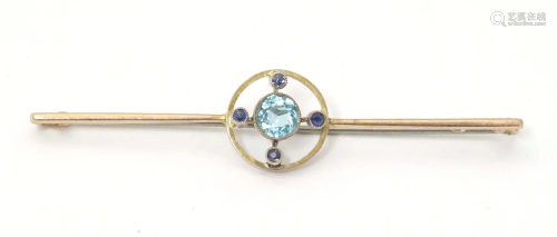 A 9ct gold bar brooch set with central aquamarine. 2 1/2&quo...