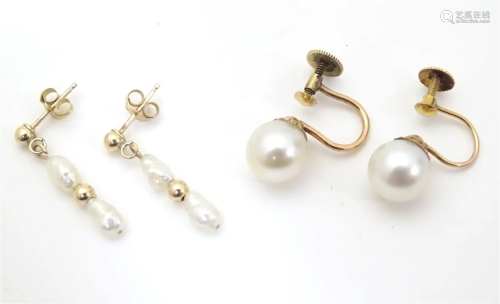 A par of yellow metal drop earrings set with pearls, togethe...