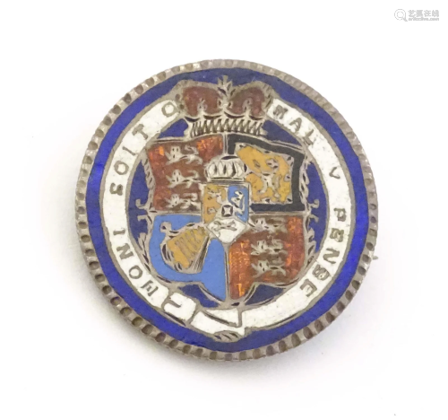 A silver brooch formed from a Geo III 1816 coin with enamel ...