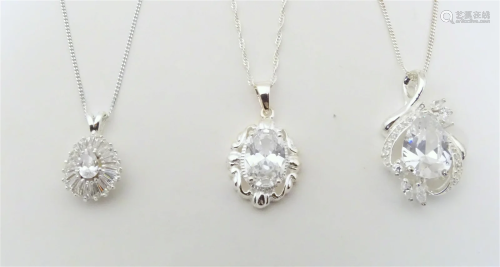 Three silver / white metal necklaces set with various pendan...