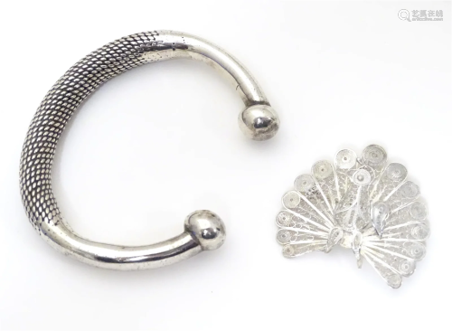A .925 silver bracelet / bangle of torque form together with...