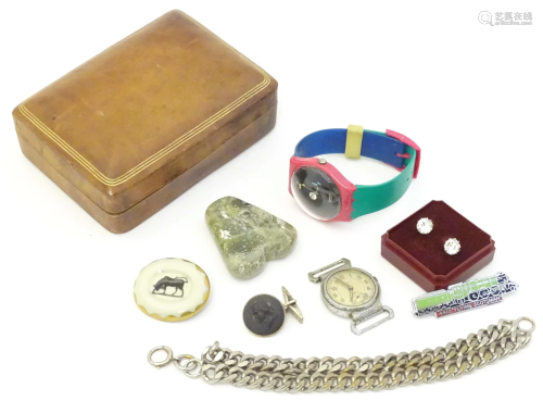 A quantity of assorted items to include a leather covered bo...