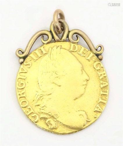 A George III 1786 gold coin with pendant hanger to top. Appr...