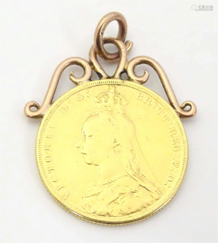 A Victorian 1890 gold sovereign coin with pendant hanger to ...