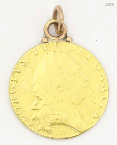 A George III 1791 gold coin with pendant loop to top. Approx...