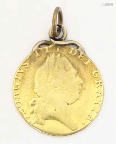 A George III 1798 gold coin with pendant hanger to top. Appr...