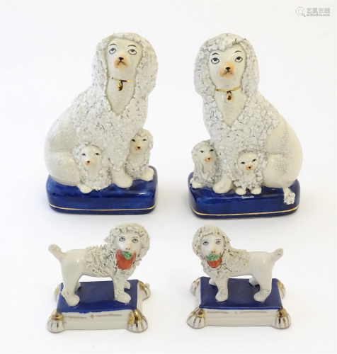 A pair of Staffordshire pottery models of seated Poodle dogs...
