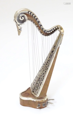 A silver model of a harp by Sachetti . Approx. 5" high