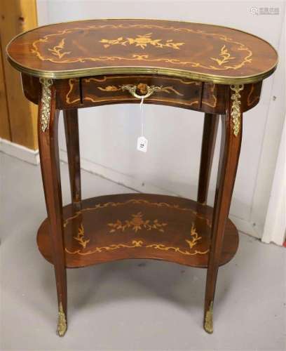 A kidney-shaped table with brass gallery and drawer, Louis X...