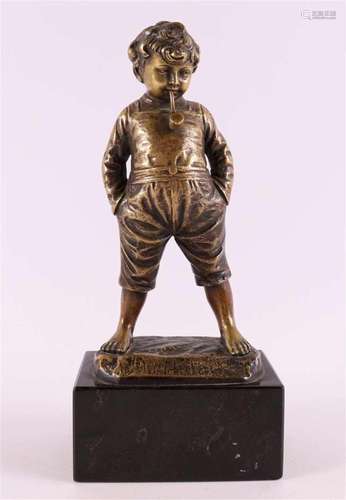 A bronze sculpture of a boy with a pipe, early 20th century.