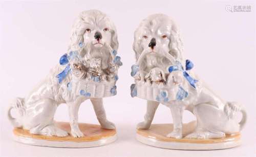 A set of pottery dogs with baskets, 20th century,