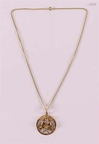 A 14 kt gold necklace on a zodiac pendant 'Gemini'.