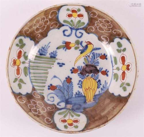 A polychrome Delft earthenware dish, Delft around 1800.