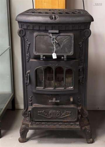 A cast iron replica wood burning stove as a gas fire, 21st c...