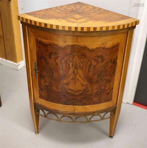 A corner cabinet, after an antique example, 20th century.