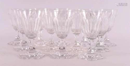 Twelve clear crystal faceted wine glasses on six-sided base