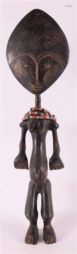 Africa, Ghana. An Ashanti-style sculpture of a standing preg...