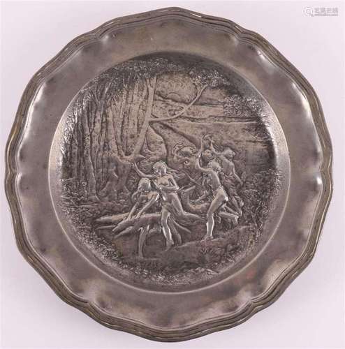 A blank pewter dish with Art Nouveau relief of forest nymphs...