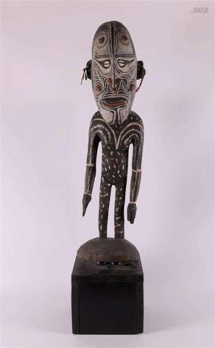 A polychrome wooden ancestor statue, Sepic, Papua New Guinea...