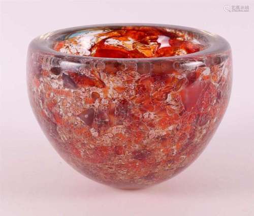 A thick-walled glass bowl with molten orange glass inside, B...