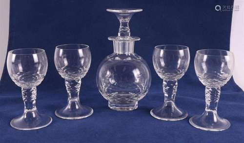 A clear glass 'Donati' decanter with four glasses, W...