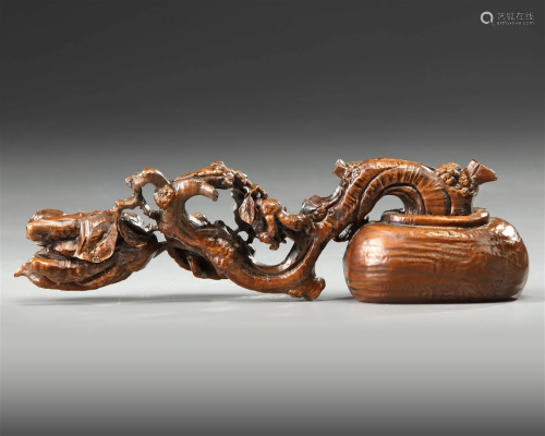 A CHINESE WOODEN BRUSH REST, 19TH CENTURY