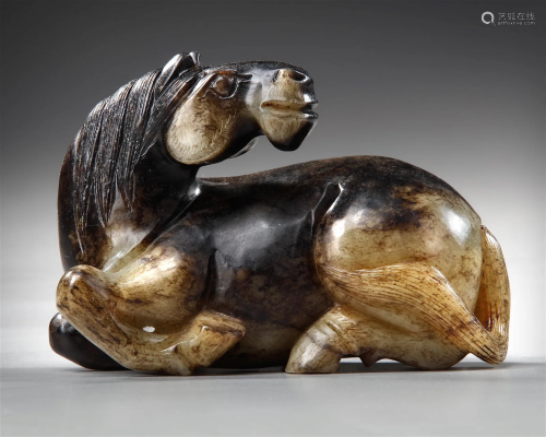 A BLACK AND CELADON JADE HORSE, 17TH CENTURY