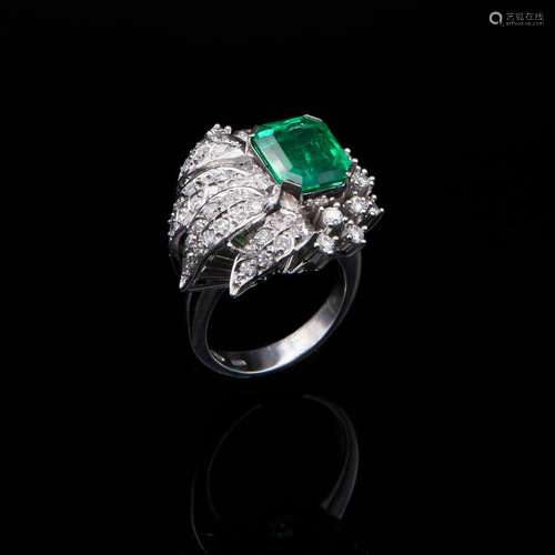 White gold ring with diamonds and Colombian emerald