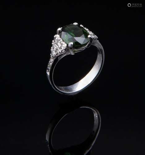 White gold ring with diamonds and Australian green sapphire