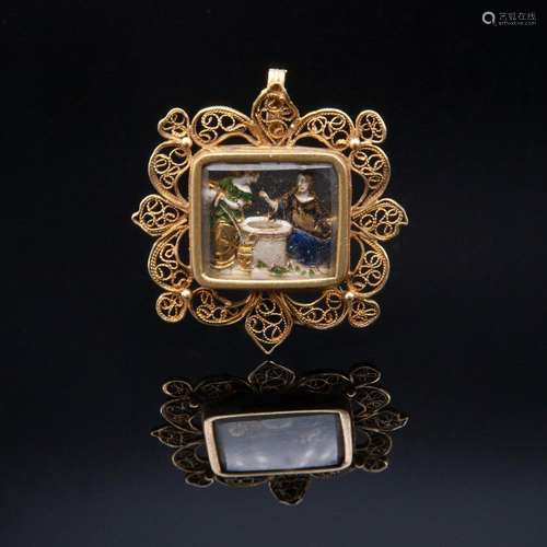 Antique pendant made of filigreed gold, rock crystal and ena...