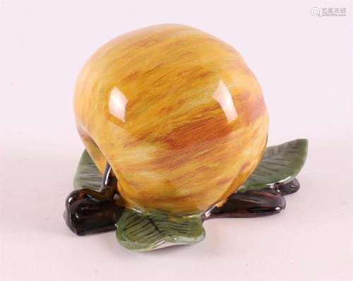An earthenware table piece in the shape of an apple, Tichela...