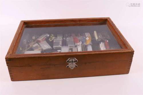 A display case containing a collection of lighters.