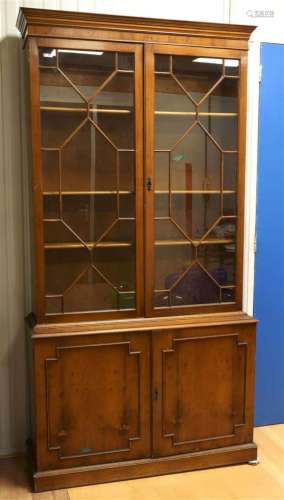 A two-door display cabinet after an antique example, England...
