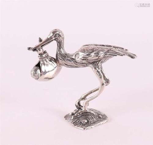 A 2nd grade silver miniature of a stork with baby.