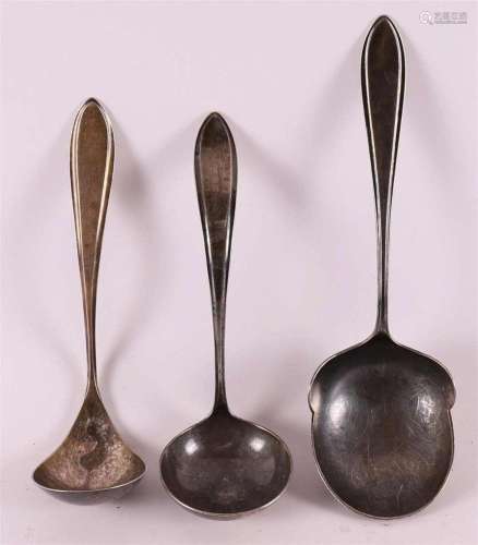 A silver potato spoon and two sauce spoons, pointed fillet, ...
