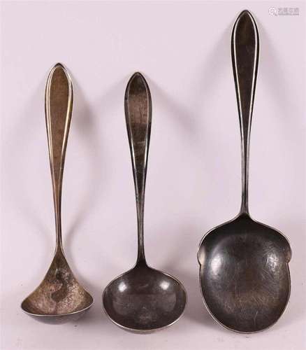 A silver potato spoon and two sauce spoons, pointed fillet, ...