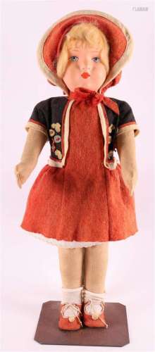 A traditional costume doll with cloth body, Germany, early 2...