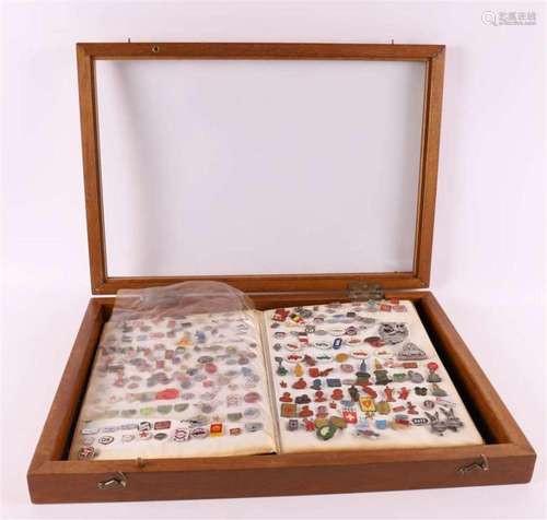 A display case containing an album with pins, including the ...