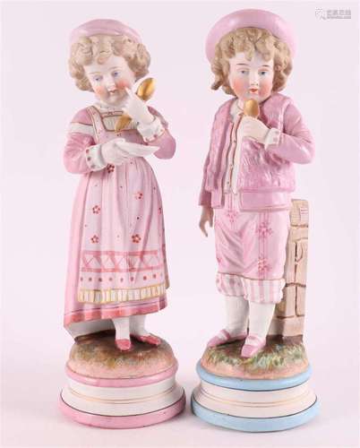 A biscuit porcelain boy and girl, Germany, circa 1900.