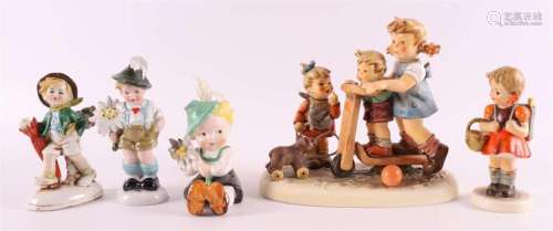 Five various polychrome porcelain figurines, including Germa...