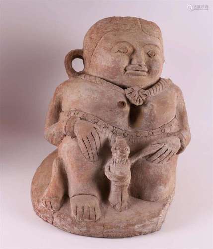 A ceramic statue in pre-Columbian style.