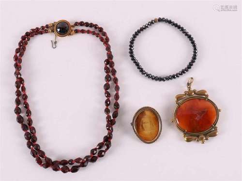 A necklace of faceted garnets on a gold clasp, late 19th cen...